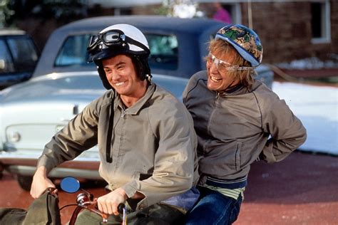 harry and lloyd on moped.